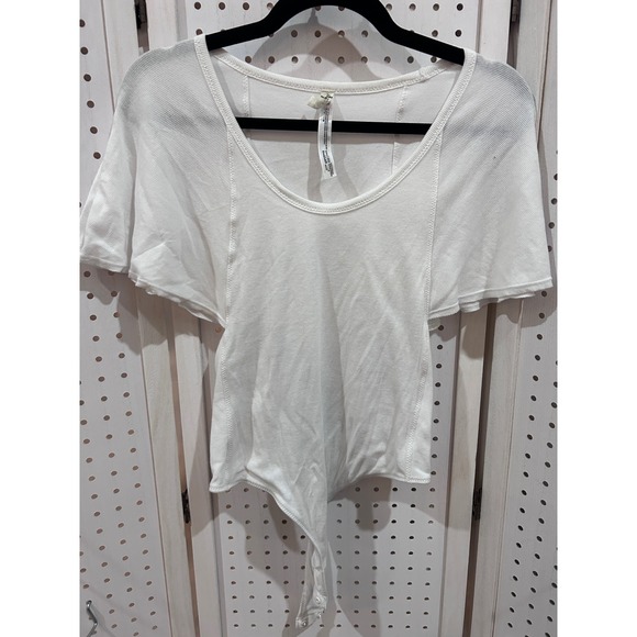 Free People Tops - Free People White Ribbed Knit Short Sleeve Bodysuit Snap Closure‎ Cutout Sides